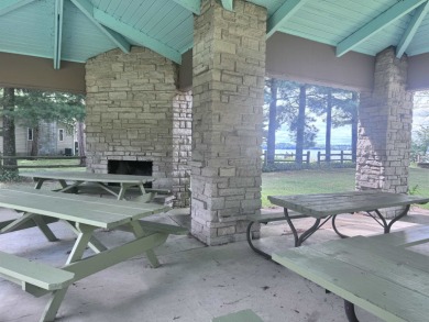 Experience refined lake living in this stunning 3BR, 2BA home on Northern Bay Golf Resort and Marina in Wisconsin - for sale on GolfHomes.com, golf home, golf lot