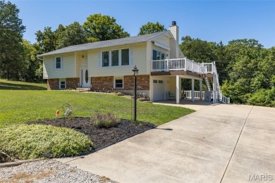 Welcome to this charming 3-bedroom, 3-bath split foyer home on Terre Du Lac Golf and Country Club in Missouri - for sale on GolfHomes.com, golf home, golf lot