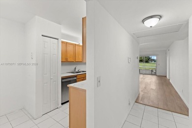 Beautiful first-floor unit featuring tile flooring throughout on Flamingo Lakes Country Club in Florida - for sale on GolfHomes.com, golf home, golf lot