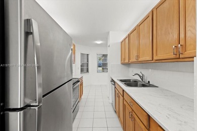 Beautiful first-floor unit featuring tile flooring throughout on Flamingo Lakes Country Club in Florida - for sale on GolfHomes.com, golf home, golf lot