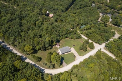 Welcome to this charming 3-bedroom, 3-bath split foyer home on Terre Du Lac Golf and Country Club in Missouri - for sale on GolfHomes.com, golf home, golf lot