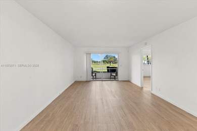 Beautiful first-floor unit featuring tile flooring throughout on Flamingo Lakes Country Club in Florida - for sale on GolfHomes.com, golf home, golf lot