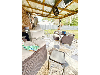 Located in unrestricted Arapahoe, this charming 3-bedroom on Minnesott Golf and Country Club in North Carolina - for sale on GolfHomes.com, golf home, golf lot