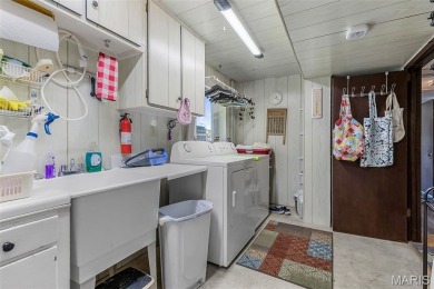 Welcome to this charming 3-bedroom, 3-bath split foyer home on Terre Du Lac Golf and Country Club in Missouri - for sale on GolfHomes.com, golf home, golf lot