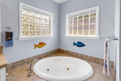 Welcome to 112 Vista Dr - Where Every Day Feels Like a Coastal on Pass Christian Isles Golf Club in Mississippi - for sale on GolfHomes.com, golf home, golf lot