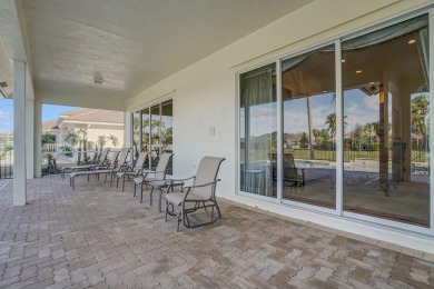 This former model home offers breathtaking lake and golf course on The Wanderers Club in Florida - for sale on GolfHomes.com, golf home, golf lot