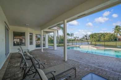 This former model home offers breathtaking lake and golf course on The Wanderers Club in Florida - for sale on GolfHomes.com, golf home, golf lot