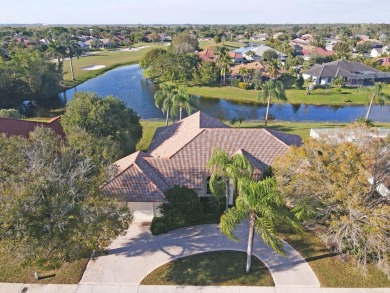 This former model home offers breathtaking lake and golf course on The Wanderers Club in Florida - for sale on GolfHomes.com, golf home, golf lot