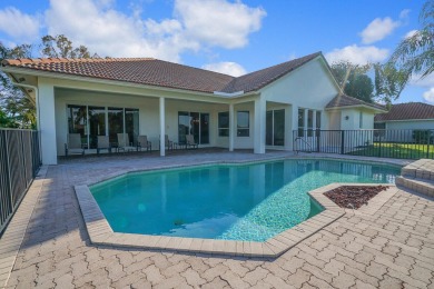 This former model home offers breathtaking lake and golf course on The Wanderers Club in Florida - for sale on GolfHomes.com, golf home, golf lot