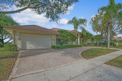 This former model home offers breathtaking lake and golf course on The Wanderers Club in Florida - for sale on GolfHomes.com, golf home, golf lot