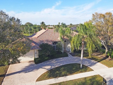 This former model home offers breathtaking lake and golf course on The Wanderers Club in Florida - for sale on GolfHomes.com, golf home, golf lot