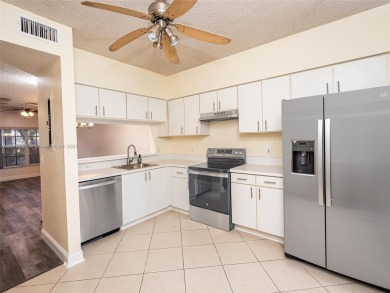 Highly renovated townhome conveniently located in the heart of on Jacaranda Golf Club in Florida - for sale on GolfHomes.com, golf home, golf lot