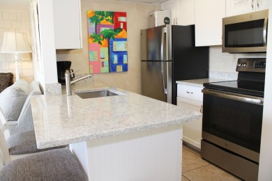 Charming 1-Bedroom Condo with Golf Course & Canal Views in on Sandpiper Cove Golf Course in Florida - for sale on GolfHomes.com, golf home, golf lot