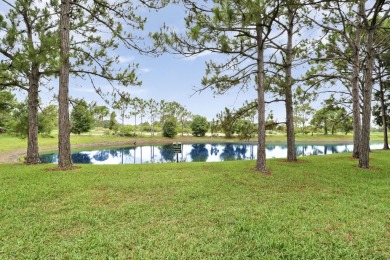 Location, location, location! SERENE LAKE VIEWS & PARTIAL GOLF on The Legacy Golf and Tennis Club in Florida - for sale on GolfHomes.com, golf home, golf lot