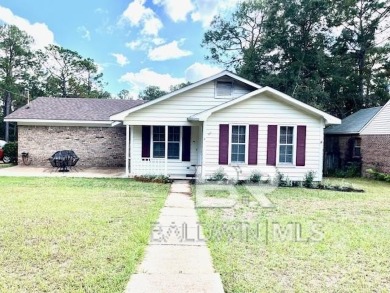 This three-bedroom, two-bathroom home is a great fixer-upper for on Lake Forest Yacht and Country Club in Alabama - for sale on GolfHomes.com, golf home, golf lot