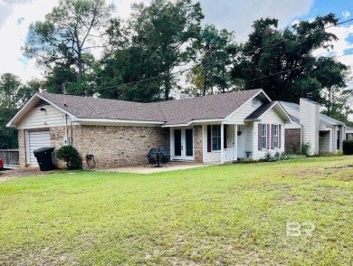 This three-bedroom, two-bathroom home is a great fixer-upper for on Lake Forest Yacht and Country Club in Alabama - for sale on GolfHomes.com, golf home, golf lot