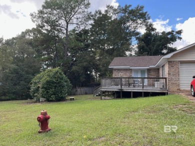 This three-bedroom, two-bathroom home is a great fixer-upper for on Lake Forest Yacht and Country Club in Alabama - for sale on GolfHomes.com, golf home, golf lot