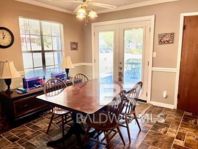 This three-bedroom, two-bathroom home is a great fixer-upper for on Lake Forest Yacht and Country Club in Alabama - for sale on GolfHomes.com, golf home, golf lot