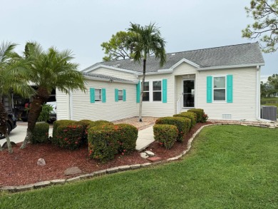 This lovely, 3 bedroom, 2 bath manufactured home is located in on Pine Lakes Country Club in Florida - for sale on GolfHomes.com, golf home, golf lot