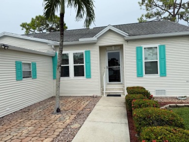 This lovely, 3 bedroom, 2 bath manufactured home is located in on Pine Lakes Country Club in Florida - for sale on GolfHomes.com, golf home, golf lot