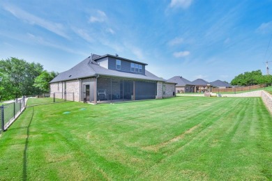 This Luxurious 5-Bedroom Home in Pecan Plantation with Upscale on Pecan Plantation Country Club in Texas - for sale on GolfHomes.com, golf home, golf lot