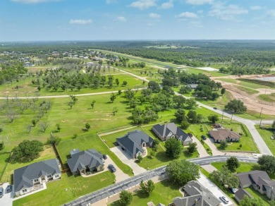 This Luxurious 5-Bedroom Home in Pecan Plantation with Upscale on Pecan Plantation Country Club in Texas - for sale on GolfHomes.com, golf home, golf lot