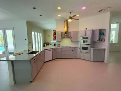 Listen to the waves crashing on the beach from this custom pool on Hammock Dunes Club in Florida - for sale on GolfHomes.com, golf home, golf lot