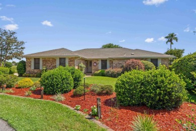 Charming Gulf Breeze brick home nestled in a picturesque setting on Tiger Point Golf and Country Club in Florida - for sale on GolfHomes.com, golf home, golf lot