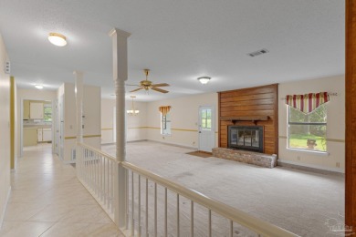 Charming Gulf Breeze brick home nestled in a picturesque setting on Tiger Point Golf and Country Club in Florida - for sale on GolfHomes.com, golf home, golf lot