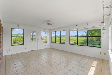 Charming Gulf Breeze brick home nestled in a picturesque setting on Tiger Point Golf and Country Club in Florida - for sale on GolfHomes.com, golf home, golf lot