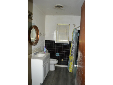 Roomy and filled with opportunity, this 4-bedroom, 2-bath home on Jake Gaither Golf Course in Florida - for sale on GolfHomes.com, golf home, golf lot