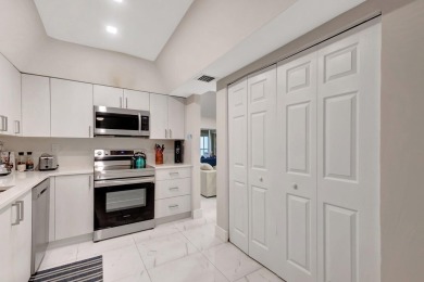 Enjoy the Florida lifestyle in this gorgeous 3rd-floor condo in on Boca Grove Golf and Tennis in Florida - for sale on GolfHomes.com, golf home, golf lot