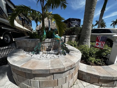 Welcome to this enchanted water and golf front tiki lot! Over on Nicholas Golf Club in Florida - for sale on GolfHomes.com, golf home, golf lot