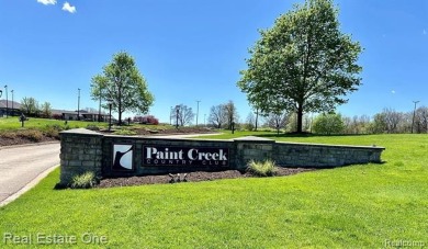 Welcome Home to this Fabulous Ranch that offers 3 bedrooms, 2 on Paint Creek Country Club in Michigan - for sale on GolfHomes.com, golf home, golf lot