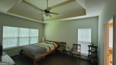Welcome to this private home tucked in the River North Golf on Canongate At Healy Point Country Club in Georgia - for sale on GolfHomes.com, golf home, golf lot