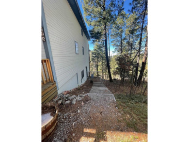 Timber framed, tri-level home with partially finished basement on The Lodge Golf Course in New Mexico - for sale on GolfHomes.com, golf home, golf lot