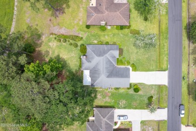 You are going to love this all brick home situated on a large on Carolina Shores Golf Course in North Carolina - for sale on GolfHomes.com, golf home, golf lot