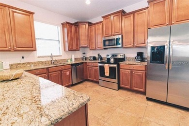 Beautifully maintained 6-bedroom, 6-bath home located in the on The Oasis Club at Champions Gate in Florida - for sale on GolfHomes.com, golf home, golf lot