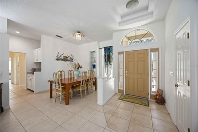 Step into this exceptional 4-bedroom, 2.5-bath pool home on The Venice Golf and Country Club in Florida - for sale on GolfHomes.com, golf home, golf lot