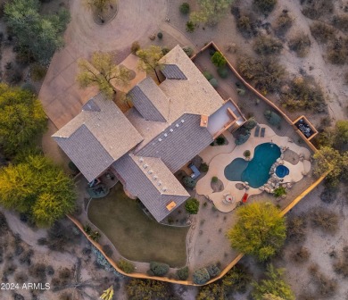 Welcome to this custom-built masterpiece nestled on a secluded 1 on The Country Club At DC Ranch in Arizona - for sale on GolfHomes.com, golf home, golf lot