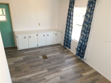This one just keeps getting better! NEW front porch screen room on Betmar Acres Golf Club in Florida - for sale on GolfHomes.com, golf home, golf lot