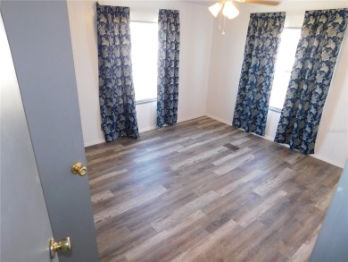 This one just keeps getting better! NEW front porch screen room on Betmar Acres Golf Club in Florida - for sale on GolfHomes.com, golf home, golf lot