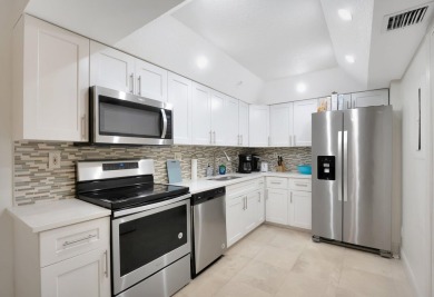 Enjoy the Florida lifestyle in this gorgeous 1st-floor condo in on Boca Grove Golf and Tennis in Florida - for sale on GolfHomes.com, golf home, golf lot