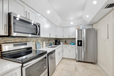 Enjoy the Florida lifestyle in this gorgeous 1st-floor condo in on Boca Grove Golf and Tennis in Florida - for sale on GolfHomes.com, golf home, golf lot