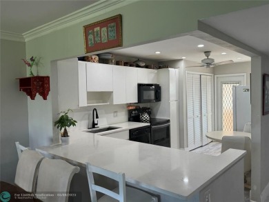 OWNER FINANCING AVAILABLE... EV ELECTRIC CHARGER  installed in on Palm-Aire Country Club and Resort - Palms in Florida - for sale on GolfHomes.com, golf home, golf lot