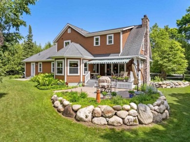 Custom designed home in a private neighborhood Stonebridge on Charlevoix Golf and Country Club in Michigan - for sale on GolfHomes.com, golf home, golf lot