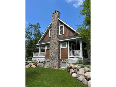 Custom designed home in a private neighborhood Stonebridge on Charlevoix Golf and Country Club in Michigan - for sale on GolfHomes.com, golf home, golf lot