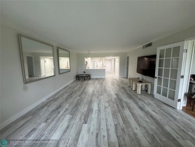 OWNER FINANCING AVAILABLE... EV ELECTRIC CHARGER  installed in on Palm-Aire Country Club and Resort - Palms in Florida - for sale on GolfHomes.com, golf home, golf lot