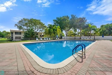 OWNER FINANCING AVAILABLE... EV ELECTRIC CHARGER  installed in on Palm-Aire Country Club and Resort - Palms in Florida - for sale on GolfHomes.com, golf home, golf lot
