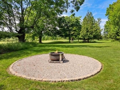 Custom designed home in a private neighborhood Stonebridge on Charlevoix Golf and Country Club in Michigan - for sale on GolfHomes.com, golf home, golf lot